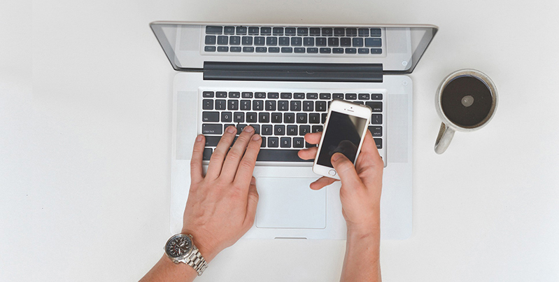 Computer, cell phone and coffee